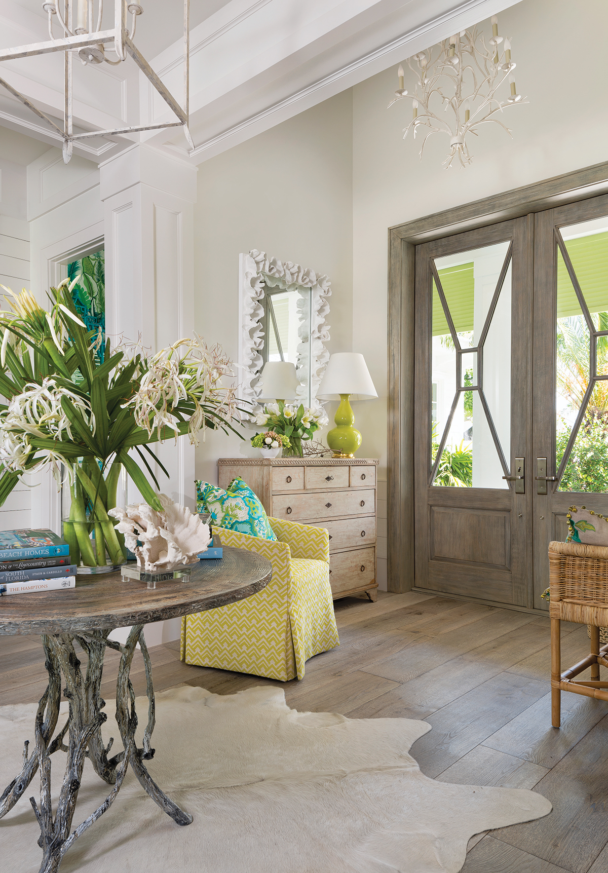 “The entry and the rest of the home is created with a mixture of antiques and new pieces, as well as some reproductions and modern pieces. So, you really have an eclectic mix like you would have in a cottage — only with a Palm Beach feel,” interior designer Bethany O’Neil says. “It’s very warm and friendly.”