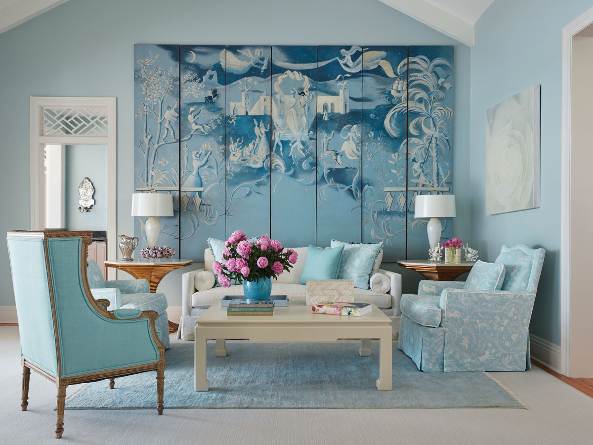 Inspiring the living room palette, China Seas’ soft pattern from Quadrille wraps a pair of lounge chairs in cool comfort. An elegant find at Newel Antiques, the Jean-Denis Malclès screen.