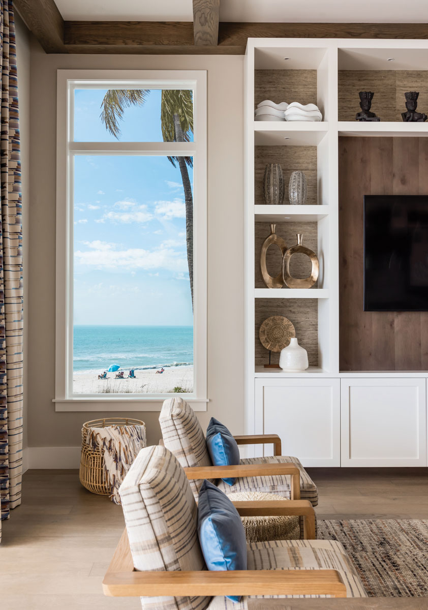 Raw driftwood mingles with Phillip Jeffries’ grass cloth to provide the backdrop for Design Works’ custom cabinetry and shelving. Open-grained oak wood flooring carries a timeless, casual elegance throughout the home.