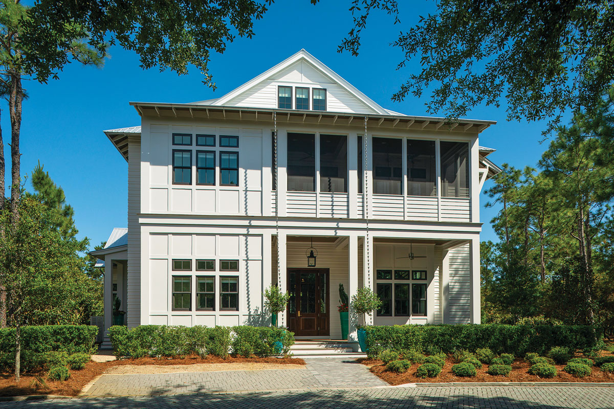 This inviting home welcomes in the sea breezes with its deep-set veranda and open-air design. The quaint Low Country–style dwelling blends seamlessly with the surrounding native foliage, instilling an element of privacy and seclusion.