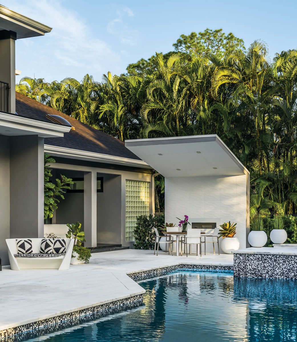 The black, white, and grey Italian mosaic pool tile connects the home’s interior palette to the outdoor living space. Idelson says it’s his favorite weekend retreat. “When I’m on the patio, I’m in another world,” he says. “I have my cup of coffee, read a book, and listen to jazz.”