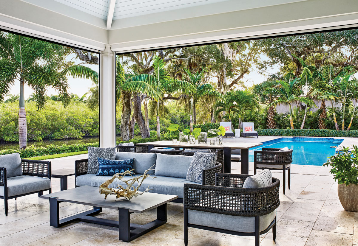 Ivory travertine pavers serve as the foundation for the lanai that is peppered with furniture chosen for durability and comfort. The dining table and coffee table are from Restoration Hardware’s Parker Collection, while the seating is from RH’s Verona Collection.