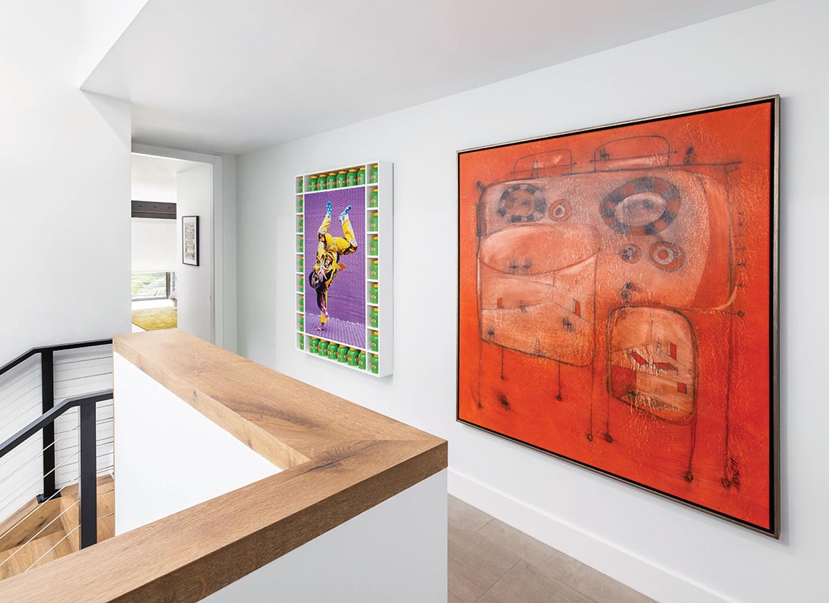Artworks on the home’s second-floor hallway include Rilene by Hassan Hajjaj (left) and La Charla by Sergio Valenzuela