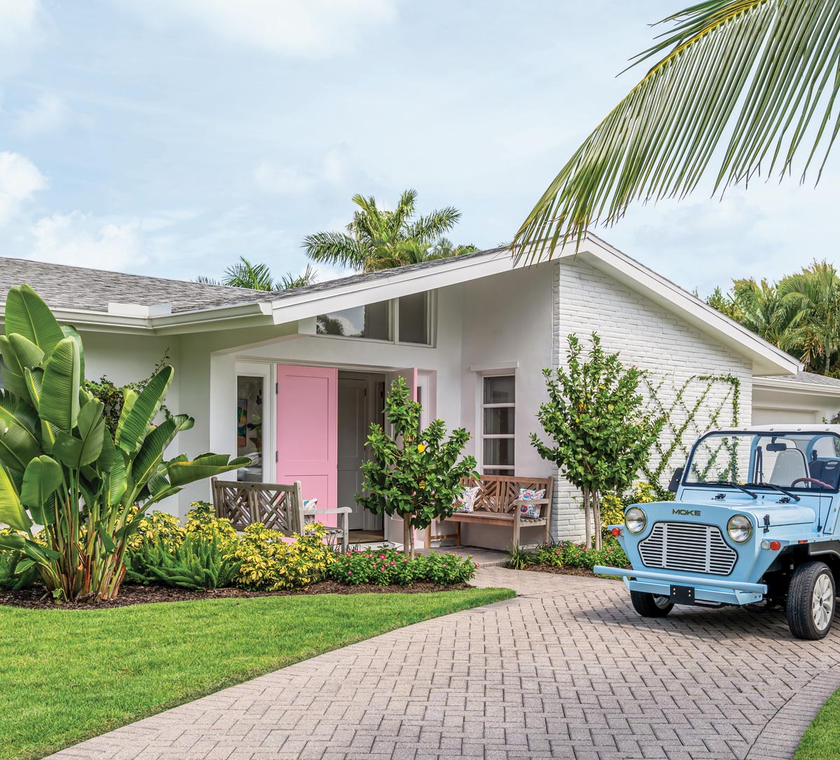 Mid-century modern lines, an updated motor court, and a happy pink front door hint at the whimsy to be found inside this renovated 1960s ranch-style cottage in Naples’ Aqualane Shores neighborhood.