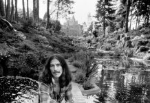 George Harrison by a creek at his Friar Park estate in a 1974 photograph by Terry O’Neill. Note the property’s mansion in the background.