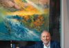 Artist Dario Campanile in front of one of his paintings, La Strada, 2023, oil on canvas. “This piece is a metaphor for the paths we all have to choose in our lifetimes,” says Campanile. “We follow the road even when we don’t know where it will lead.”