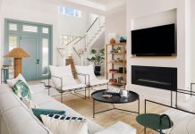 When selecting furnishings, interior designer Siamak Mostoufi consciously considered light, texture, space, shape, and color, as he does with all his projects. In the living room, one of his favorite pieces is the Sierra chair by Croft House: “Plush cushions are nested in a thin metal frame suspended from black and white jute webbing; the look definitely speaks to the casual beach house vibe.” Along with a sofa from RH, the chairs surround a steel coffee table, also from Croft House.