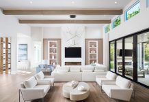 Vanguard Furniture’s Lucca sectional was chosen to complement the recessed wall detail the design team created for the great room. Book-matched porcelain tiles surround the fireplace. A nearby conversation area with chairs from Fairfield and a freeform coffee table from Four Hands make good use of the space.