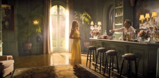 Kristen Wiig and Josh Lucas in a scene from season one of Palm Royale. The Apple TV+ show’s production design was inspired by the work of legendary interior designer Tony Duquette and the Palm Beach photography of Slim Aarons. Photo courtesy of Apple TV+