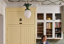 Designer Beata Heuman surrounded by various colors from The Dependables paint collection