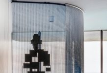 In a Sunny Isles Beach condo residence at Porsche Design Tower, a cubist figure by sculptor Antony Gormley is one of the highlights of the modern art collection that designers Sabrina MacLean and Carola Hinojosa helped the homeowners curate.