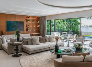 “The expansive living room was reprogrammed into two distinct zones: one for relaxed TV viewing and another for entertaining,” says designer Ivonne Ronderos. “A sculptural dome subtly anchors the cocktail area while a custom, double-sided Minotti sofa connects both spaces.”