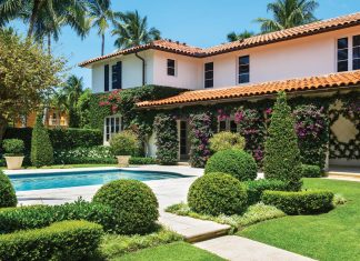 Vibrant bougainvillea blooms along the terrace of the Tropical Pool Garden, which includes topiaries of various sizes