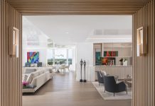 Designed with entertaining in mind, the open layout of this Naples condo residence encourages easy movement between the living areas, kitchen, and lounge. “The bar and lounge area was conceived as a natural pause point where conversations can begin before dinner and linger long after,” says designer L.A. DeRiggi.