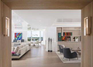 Designed with entertaining in mind, the open layout of this Naples condo residence encourages easy movement between the living areas, kitchen, and lounge. “The bar and lounge area was conceived as a natural pause point where conversations can begin before dinner and linger long after,” says designer L.A. DeRiggi.